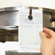 Server posting restaurant kitchen ticket